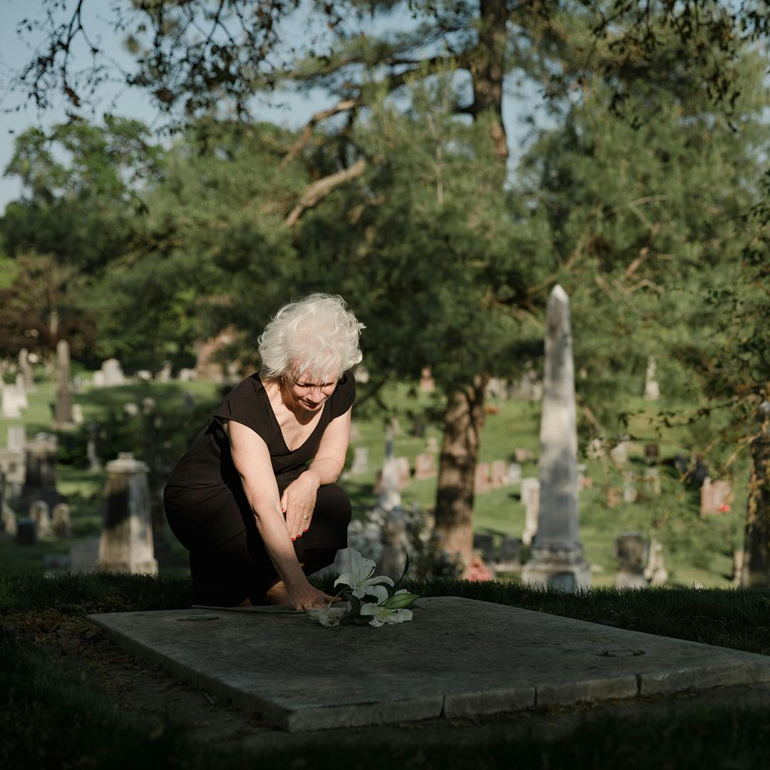 woman at a grave site for her loved one