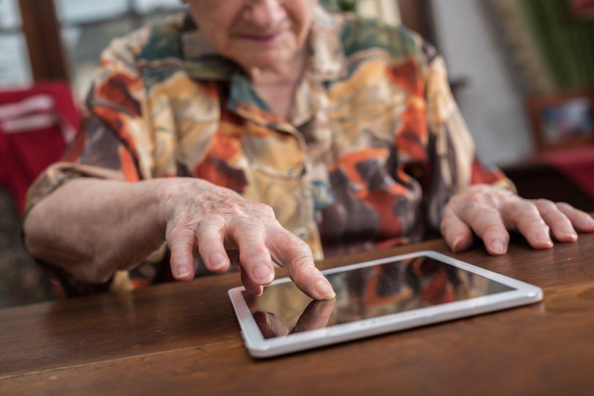 Elderly woman using a tablet