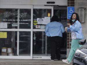 Two employees entering a nursing home