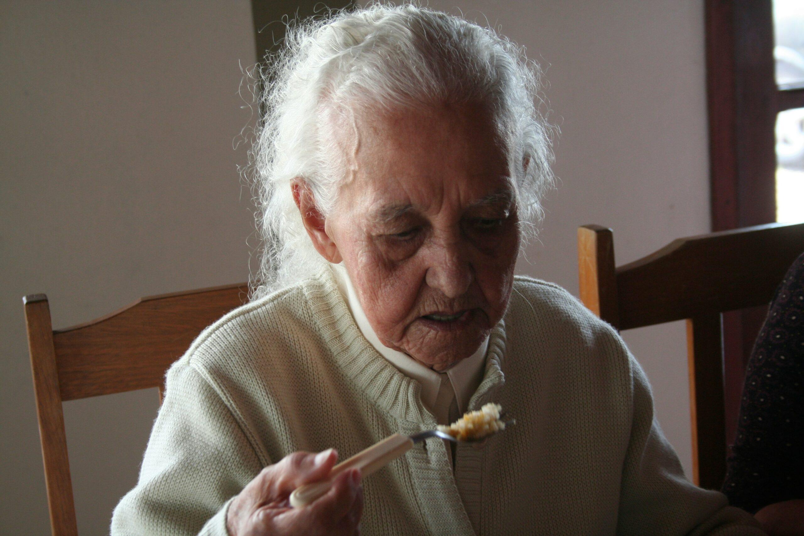 elderly woman eating