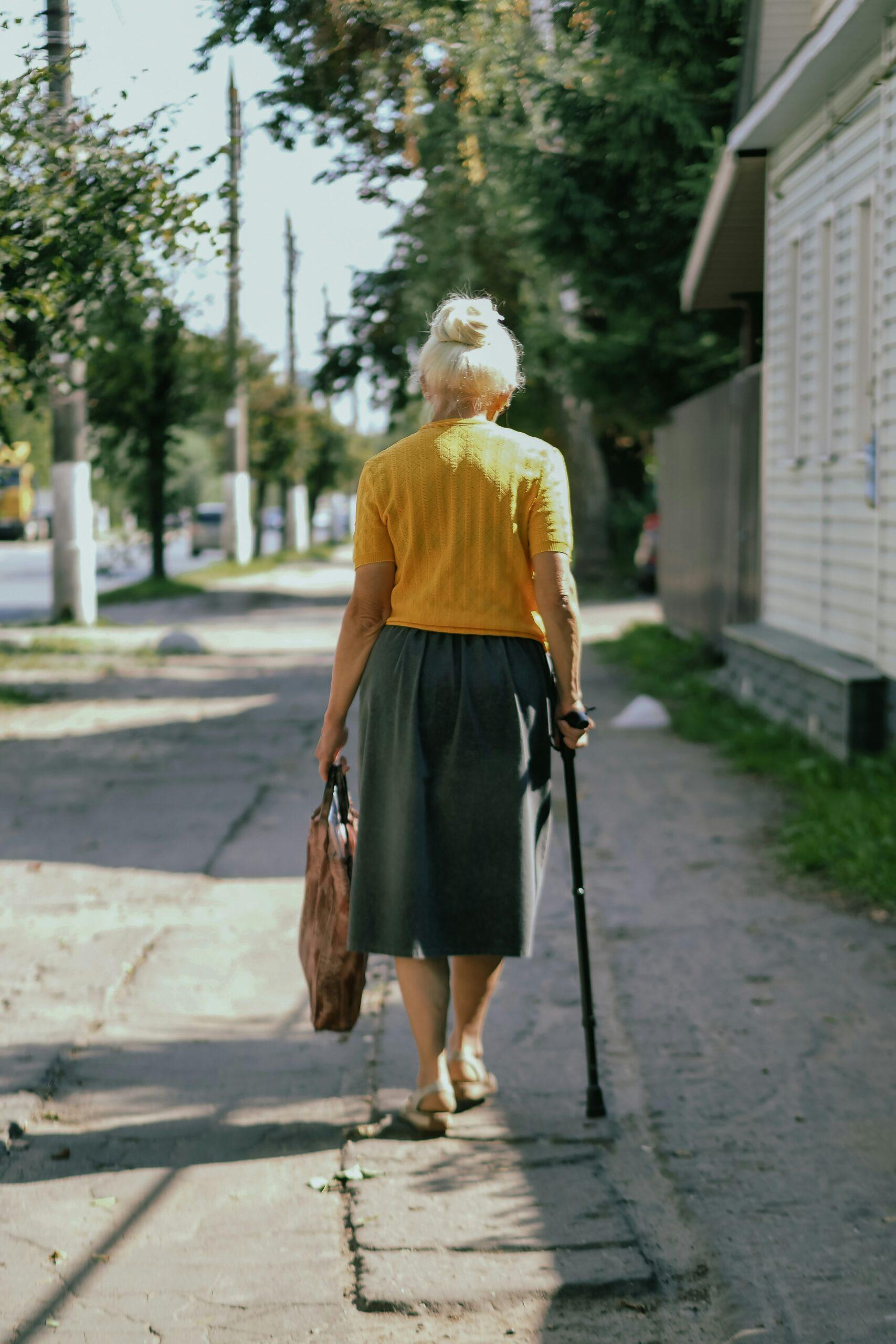 Elderly woman with a cane