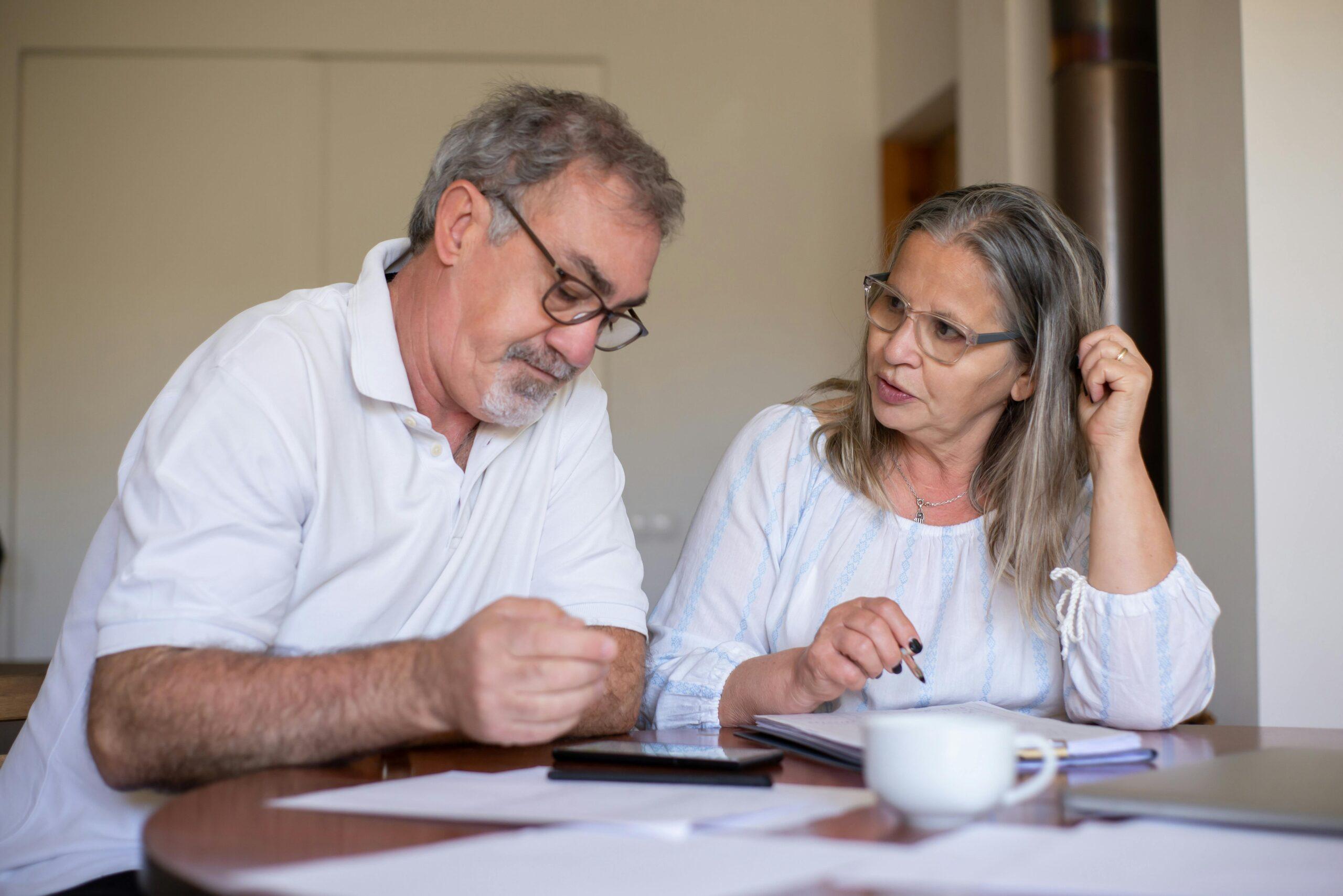 elderly couple doing finances